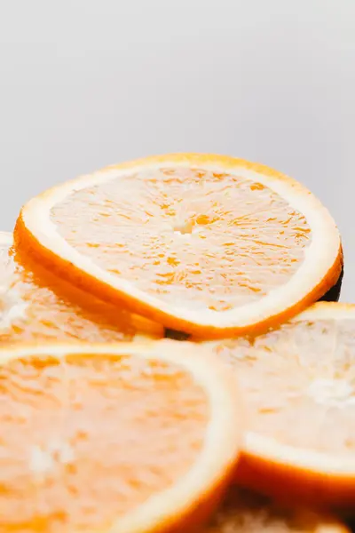 Sliced orange halves on a dark background closeup — Stock Photo, Image