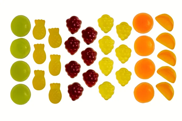 Gummi di frutta caramelle assortimento su bianco — Foto Stock