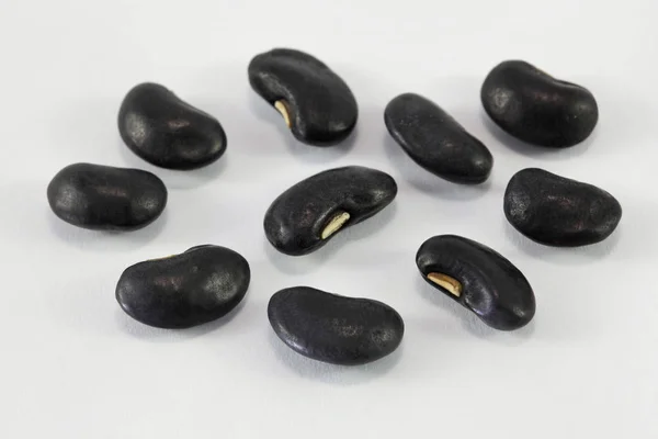 A lot of black bean on white background — Stock Photo, Image