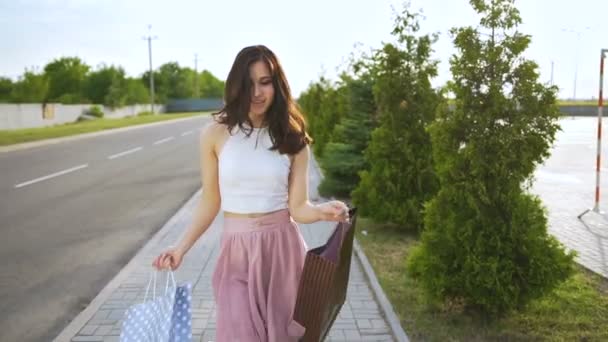 Young handsome woman is dancing after shopping — Stock Video