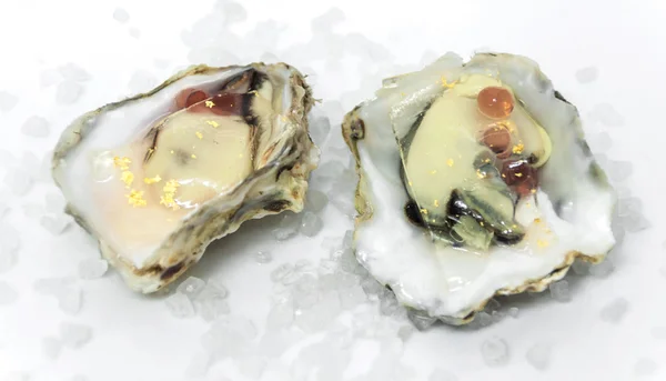 Oysters with caviar on a white background — Stock Photo, Image