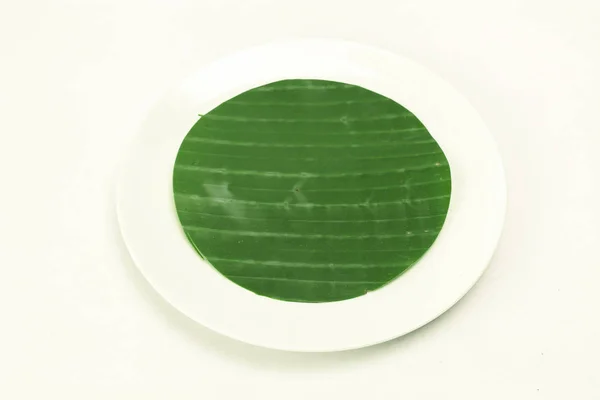 Banana leaf on blank plate for edit food or subject on — Stock Photo, Image