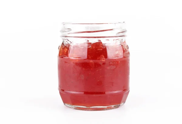 Fresh strawberry jam in glass bottle with mint leaf — Stock Photo, Image