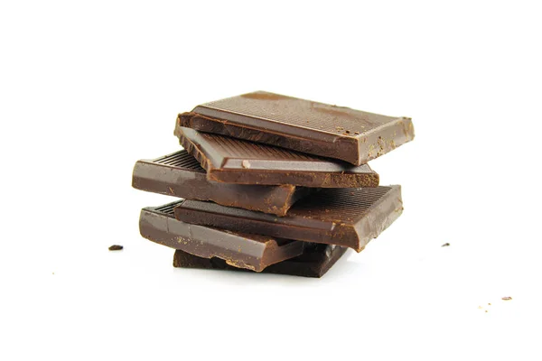 Crema de chocolate y trozos de chocolate sobre fondo blanco — Foto de Stock