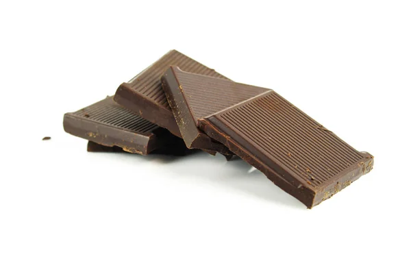 Crema de chocolate y trozos de chocolate sobre fondo blanco — Foto de Stock