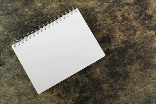 Brown blank notebook on wooden background — Stock Photo, Image