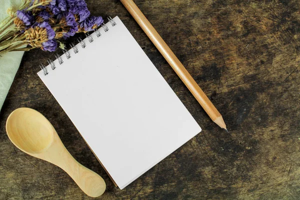 Brown blank notebook on wooden background — Stock Photo, Image