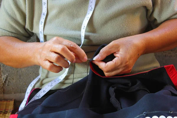 Women are sewing, tribal dress, Phuthai dress