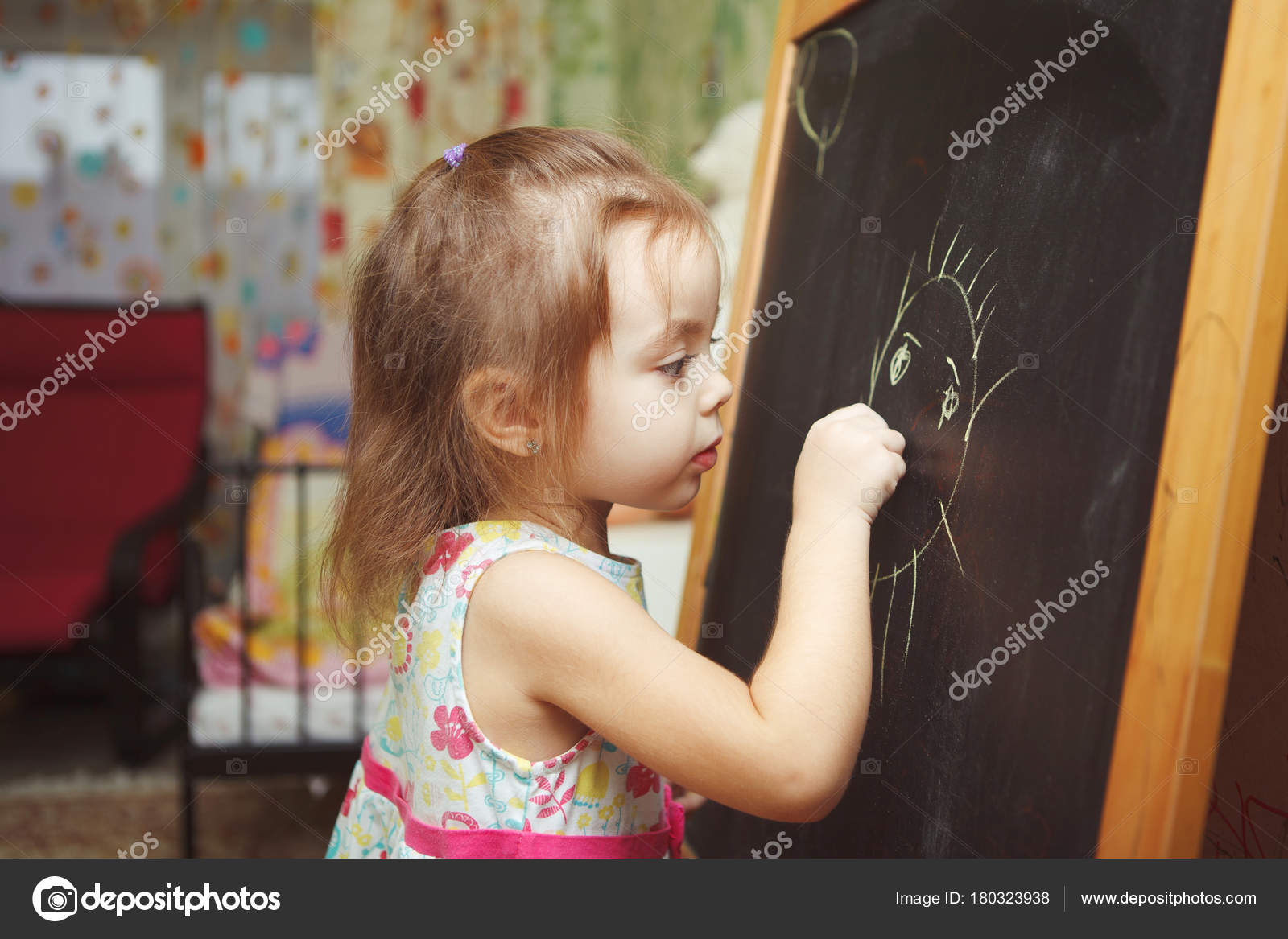 Girl With Ponytail In Process Of Drawing Picture Of Sun