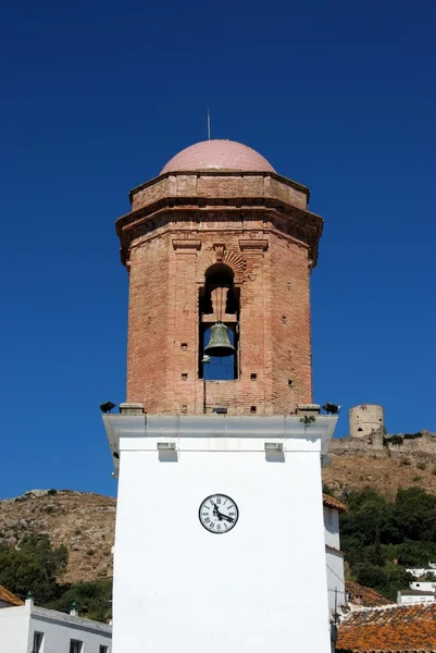 Bell tower in the town square with the castle to the rear, Jimena de la Frontera, Spain. — ストック写真