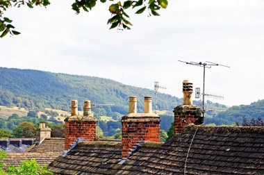 Cottage rooftops with chimney pots, Bakewell, UK. clipart