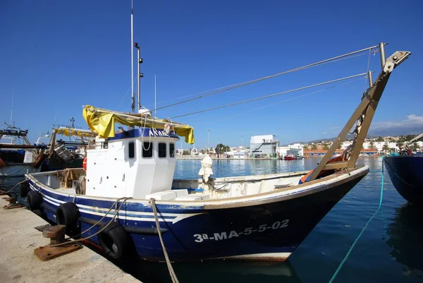 Traditional fishing boats and trawlers moored in the harbour, Caleta de Velez, Spain. — Stock Photo, Image