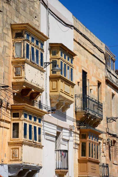 Buildings with interesting balconies and windows, Vittoriosa (Birgu), Malta, Europe.