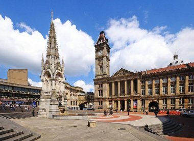 Chamberlain memorial in Chamberlain Square with the clock tower of Birmingham museum and art gallery to the rear, Birmingham, UK. clipart