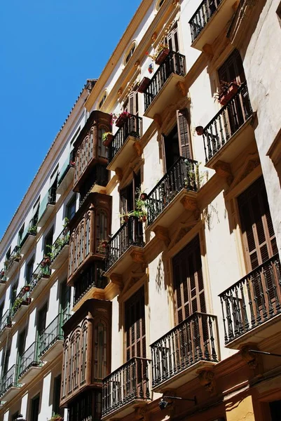 Traditional Spanish balconies on inner city apartments, Malaga, Spain. — Stock Photo, Image