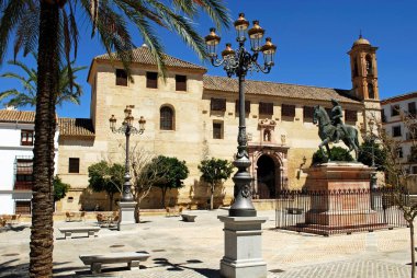 View of the convent (Convento de Santa Catalina) in the Plaza Guerrero Munoz and a statue of Fernando I (King of Aragon), Antequera, Spain. clipart