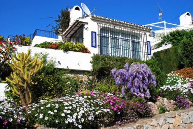 View of a villa with pretty garden, Urb Calypso, Sitio de Calahonda, Mijas Costa, Costa del Sol, Malaga Province, Andalucia, Spain. clipart