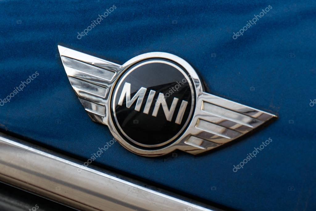 Milan, Italy - February 19, 2017 - Mini cooper car logo on a blue Mini Cooper car.