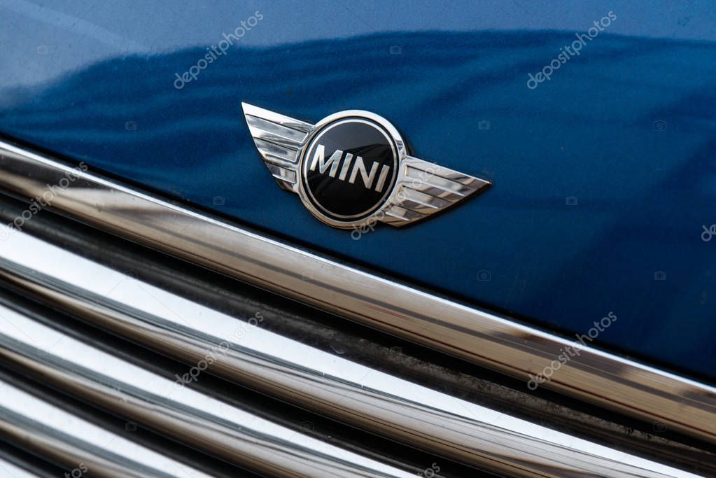 Milan, Italy - February 19, 2017 - Mini cooper car logo on a blue Mini Cooper car.