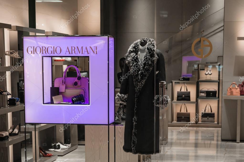 Milan, Italy - October 9, 2016: Shop window of a Giorgio Armani shop in Milan - Galleria Vittorio Emanuele II, Italy. Few days after Milan Fashion Week. Fall Winter 2017 Collection. Brand of Armani fashion house founded in 1975 by Giorgio Armani.