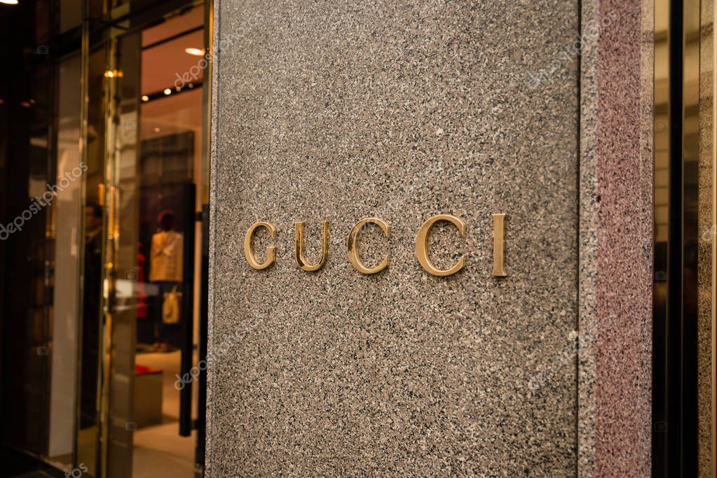 Milan, Italy - October 9, 2016: Shop window and entrance of a Gucci shop in Milan - Montenapoleone street, Italy. Few days after Milan Fashion Week. Fall Winter 2017 Collection.