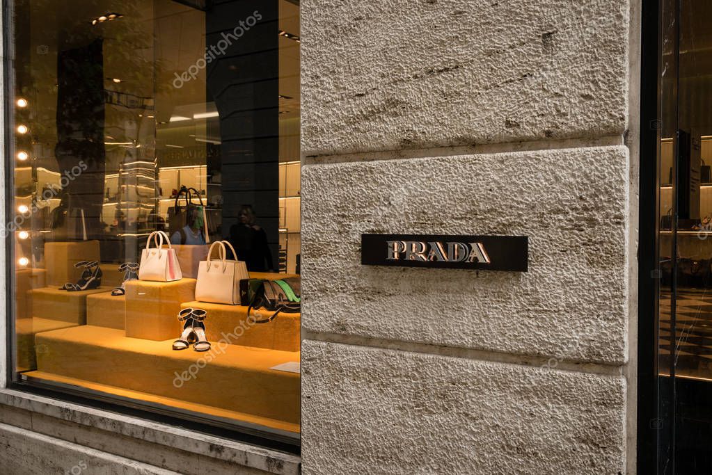 Milan, Italy - October 8, 2016: Window and entrance of a Prada shop in Milan - Montenapoleone area, Italy. Few days after Milan Fashion Week. Fall Winter 2017 Collection.