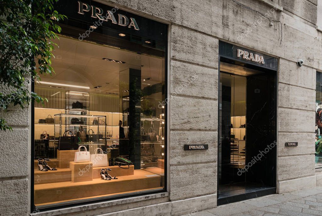 Milan, Italy - October 8, 2016: Window and entrance of a Prada shop in Milan - Montenapoleone area, Italy. Few days after Milan Fashion Week. Fall Winter 2017 Collection.