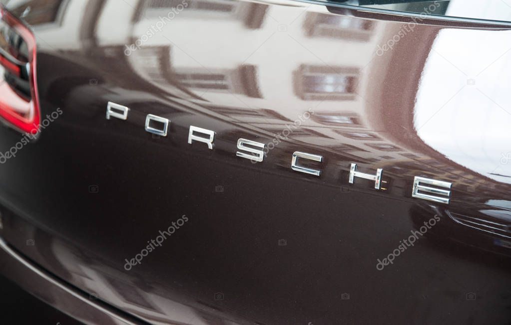 Milan, Italy - February 27, 2017 - Porsche car logo on a dark Porsche car.