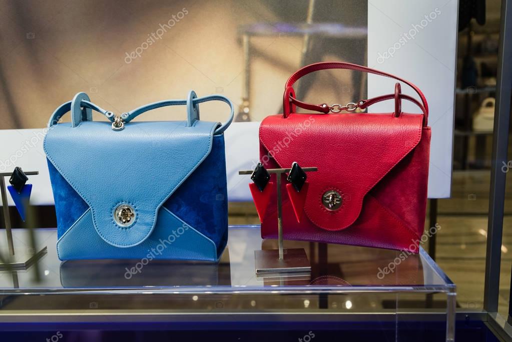 Milan, Italy - February 28, 2017: Shop window of a Armani shop in Milan - Montenapoleone area, Italy. Few days after Milan Fashion Week. Armani bags Spring Summer 2017 Collection.