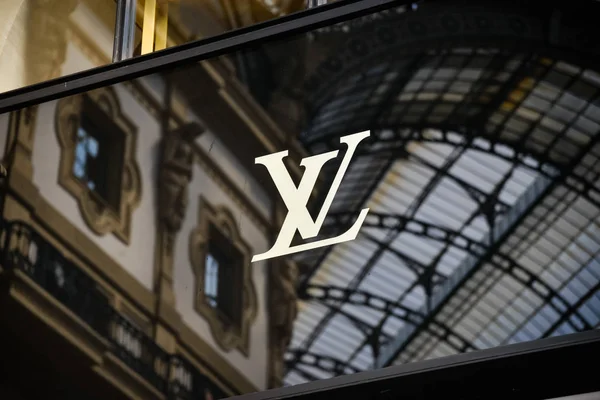 Louis Vuitton Logo on a Glass Against Blurred Crowd on the Steet