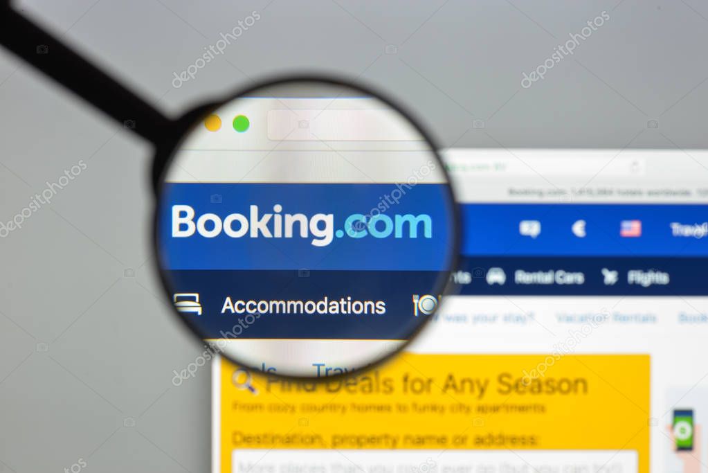 Milan, Italy - August 10, 2017: Booking.com website homepage. It  is a travel fare aggregator website and travel metasearch engine for lodging reservations. Booking logo visible.