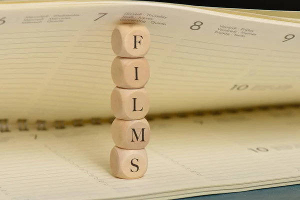 films word on wooden cubes. films concept