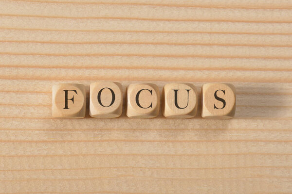 Focus word on wooden cubes. Focus concept