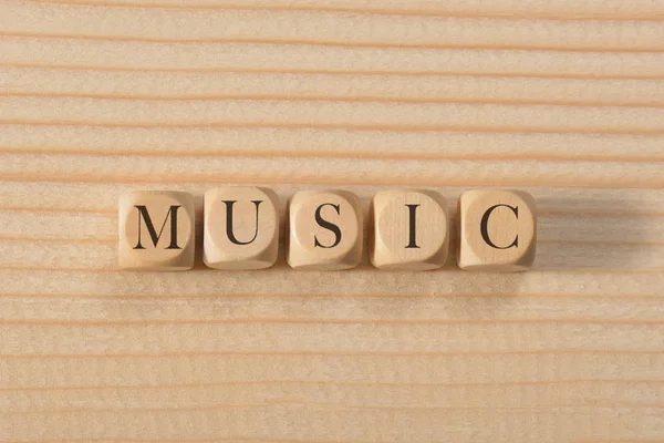 Muzyka słowo na drewnianych kostek. Koncepcja muzyki — Zdjęcie stockowe