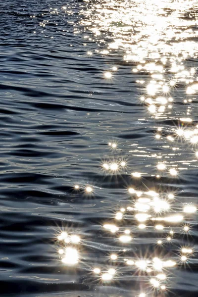 evening sun and sparkles in the sea