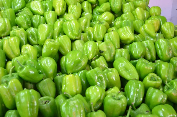 Pictures of green stuffed peppers in a grocery sales section