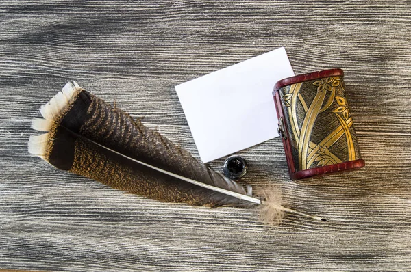 the nostalgic bird feather pen and letter paper