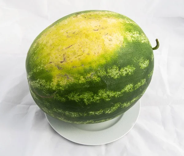 Indispensable fruit of summer months watermelon, waiting for you to be cut with a knife — Stock Photo, Image