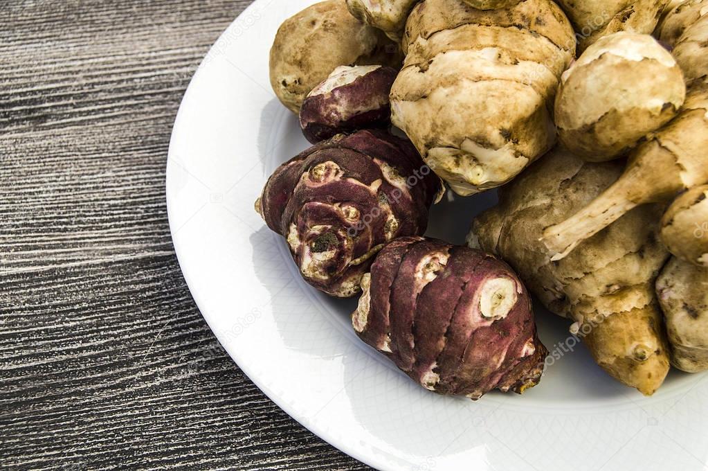 Jerusalem artichoke from tuberous plants, in plateJerusalem artichoke is very useful in terms of health, in the plateJerusalem artichoke in different ways, interesting 