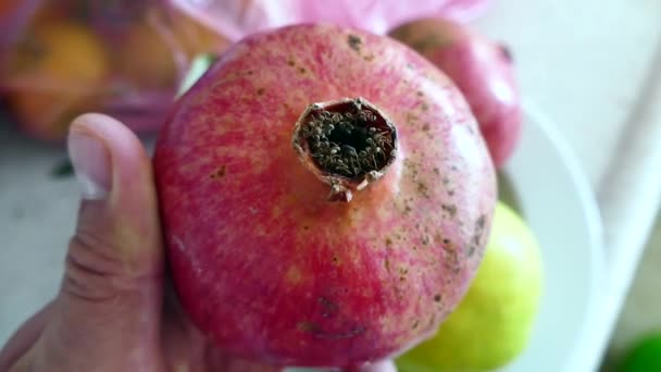 Man Turning Pomegranate Fruit His Hand — Stock Video