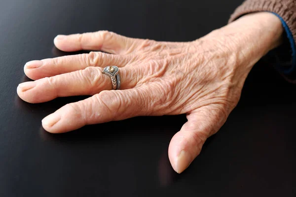 80 years old woman's hand, old human hand with veins