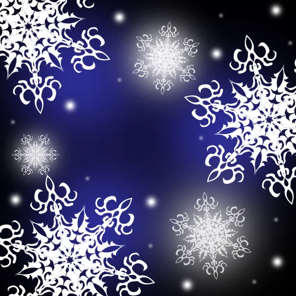 Белые снежинки на синем и черном фоне — стоковое фото
