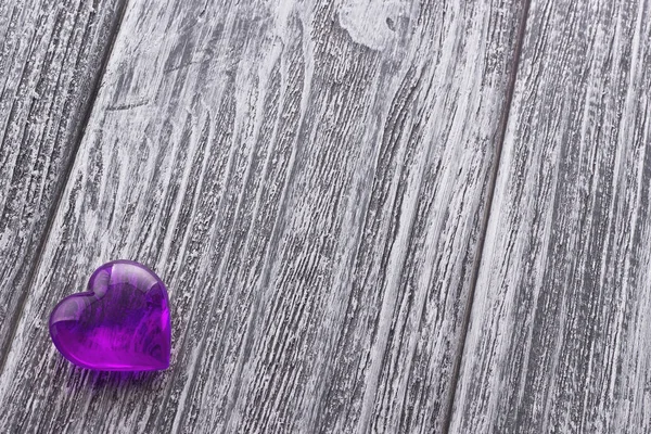 Purple Heart on the gray painted wooden background