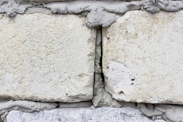 Pared dos ladrillos blancos con cemento gris . — Foto de Stock