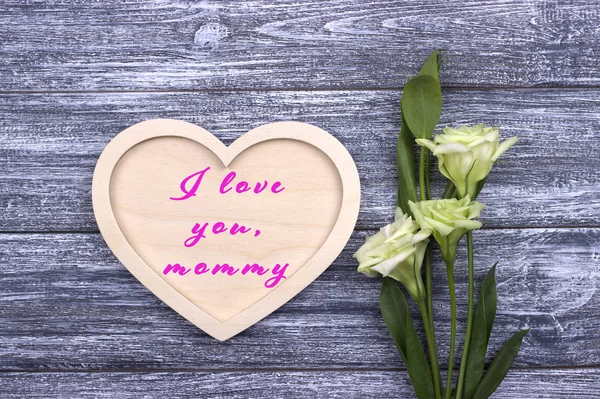 Decorative white wooden heart on grey wooden background with lettering Happy Mother's Day. — Stock Photo, Image