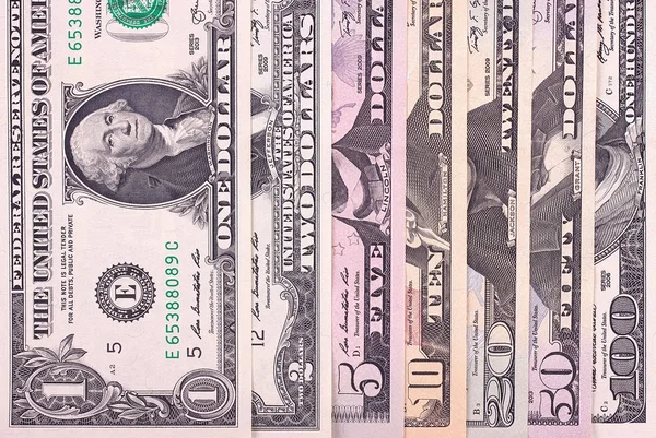 Abstrakte Dollarscheine unterschiedlicher Stückelungen Hintergrund. — Stockfoto