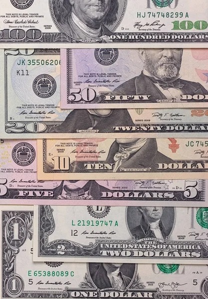Αμερικανών λογαριασμούς δολαρίων των διαφορετικών ονομαστικών αξιών αφηρημένα φόντο. — Φωτογραφία Αρχείου