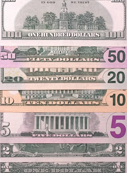 Amerikanische Dollarscheine verschiedener Stückelungen abstrakter Hintergrund. — Stockfoto