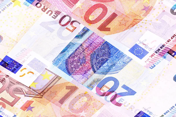 Euro geld bankbiljetten van verschillende denominaties abstract achtergrond. — Stockfoto