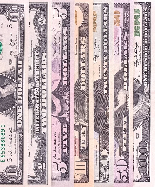 Αφηρημένη λογαριασμούς δολαρίων των διαφορετικών ονομαστικών αξιών φόντο. — Φωτογραφία Αρχείου